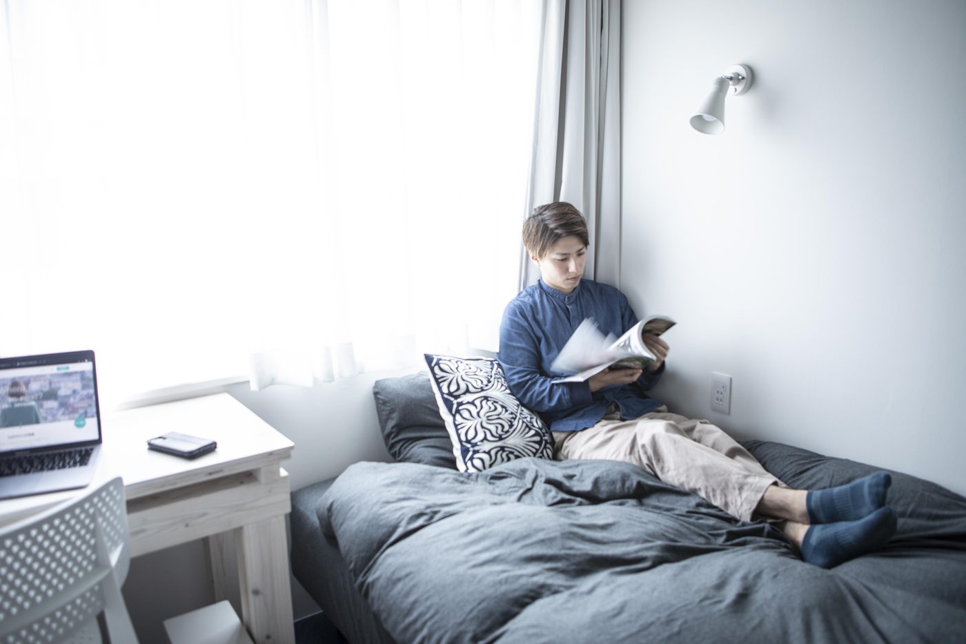 Resident reading in a private room